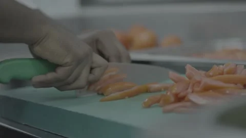 Close-up of hands cutting fresh tomatoes on a green board Stock-Footage 327355936