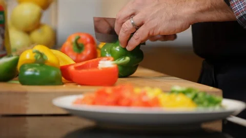 Close up of hands cutting a green pepper.  Stock Footage 106077597