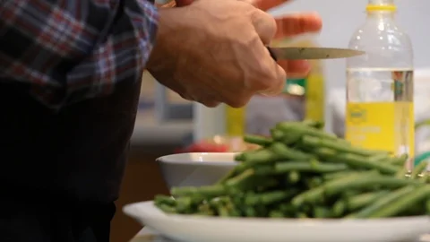 Close up of hands cutting long green asparagus. Stock Footage 106078002