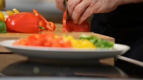 Close up of hands cutting a red pepper. 스톡 동영상 106077691