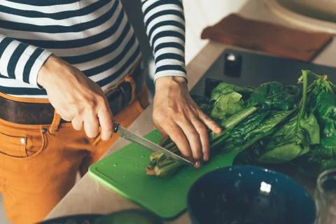 Close up of hands cutting spinach Stock Photos