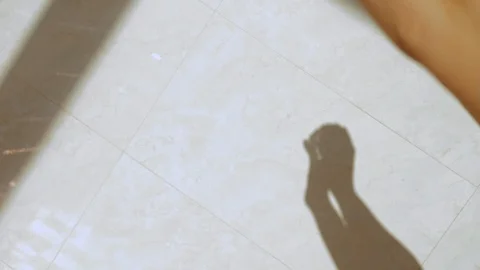 Close up hands dancing with sunlight. Shadow of hands on the wall Video stock 105027989