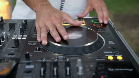 Close up hands deejay mix the music from the console. Super Slow motion 4K Video stock 238376869