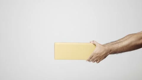 Close up hands delivery man sending the parcel box cardboard on isolated white b Stock Footage 144258018