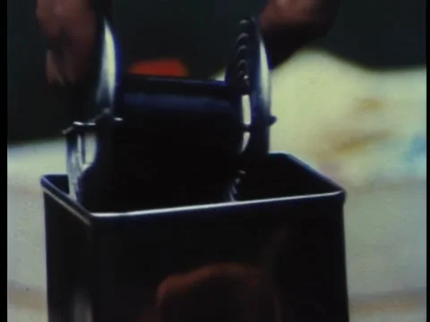 Close-up of hands developing spool of film Video stock 260252503
