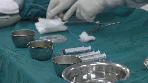 Close up hands of doctors preparing operation tools Stock Footage 129496565