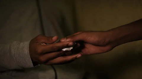 Close up of hands doing a drug deal, in slow motion Stock Footage