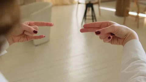 Close-up of hands doing a neuro gymnastics brain exercise. Brain gym Stock Footage 306943470