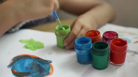 Close up hands drawing with colored dyes at sunny room rapid slow motion Stock Footage 88066248