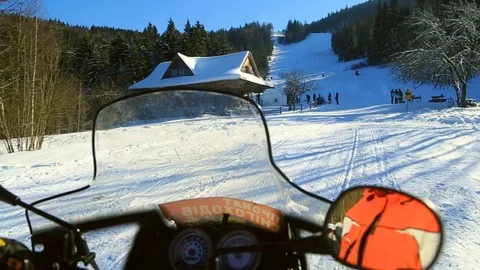 Close up hands drive snowmbiles having fun sitting in mountains resort activity Stock Footage 105265904