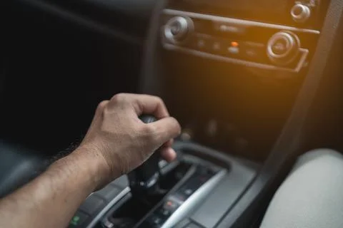 Close up of hand's driver control car gear Stock Photos