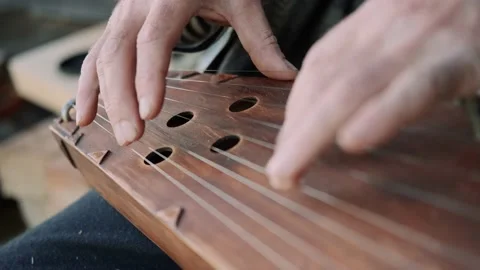 Close-up of hands. The elder plays a folk stringed musical instrument. Gusli. Stock Footage 136462293