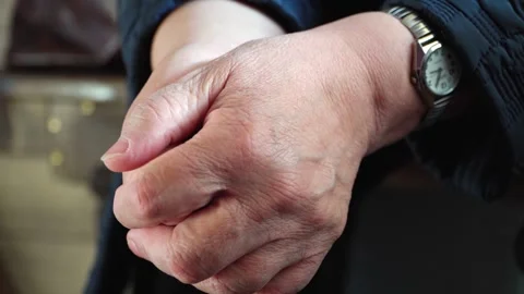 Close-up of the hands of an elderly 70-year-old woman. Flabby hands. Stock Footage 252348150