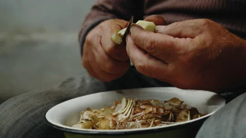 Close-up, Hands of an Elderly Country Man Peel potatoes with a Small Knife Stock Footage 158510251