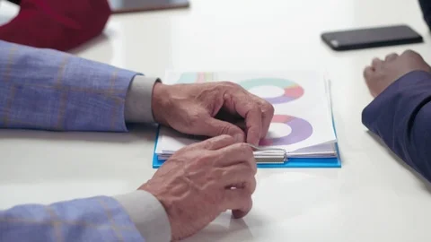 Close up of hands of elderly man lying on white table Stock Footage 99258300
