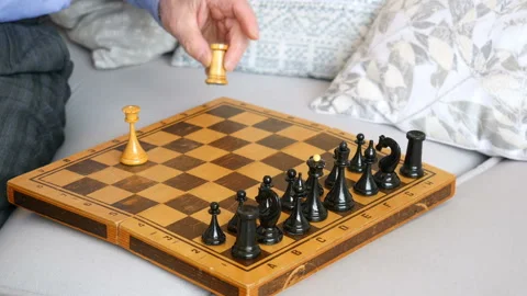 Close-up, hands of an elderly man playing chess with himself Stock Footage 99696106