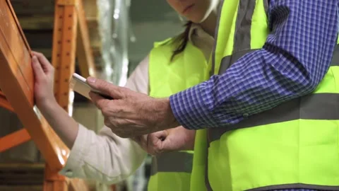 Close-up of the hands of an elderly manager and a young employee with a computer Stock Footage 171103361