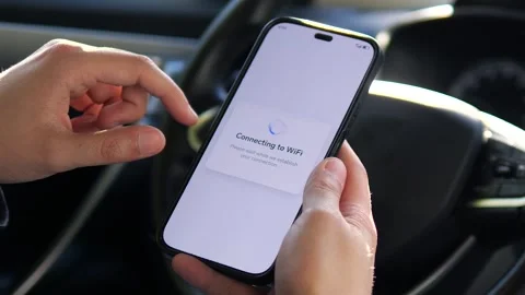 Close-up of hands enabling an internet connection via Wi-Fi on a mobile device Stock Footage 315649622