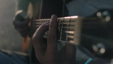 Close up hands ending play the guitar, sunny weather Stock Footage 138158843