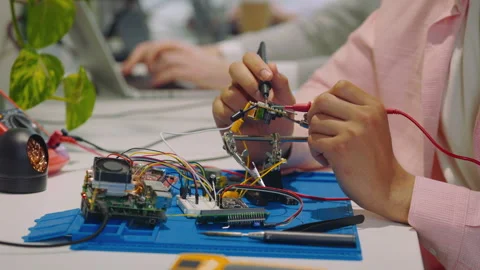 Close Up of the Hands of the Engineer Checking Circuit Voltage with Electric Stock Footage 244582666