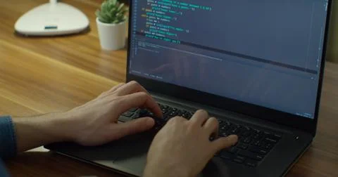 Close up hands engineers developing software app using digital laptop computer 库存照片
