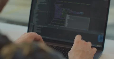 Close up hands engineers developing software app using digital laptop computer Stock Photos