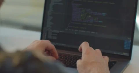 Close up hands engineers developing software app using digital laptop computer Stock Photos