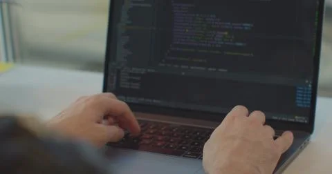 Close up hands engineers developing software app using digital laptop computer Stock Photos