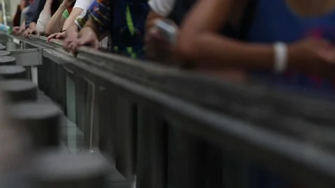 Close up of hands on an escalator Stock Footage 144856996