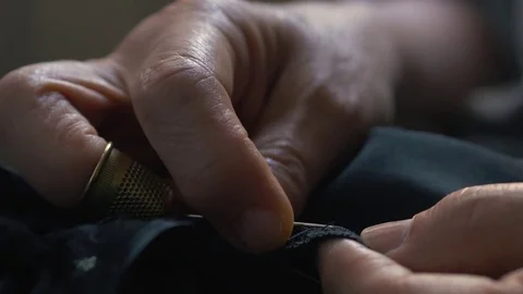 Close up of the hands of expert female tailor Stock Footage 76126296