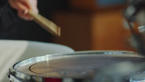 Close-Up of Hands of Female Drummer Hitting Drums with Sticks Stock Footage 276825820
