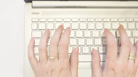 Close-up on hands of a female specialist working on laptop computer Stock Footage 252920568