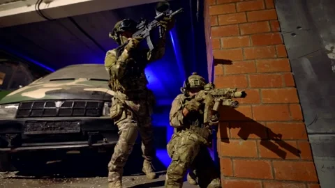 Close-up of the hands of a fighter loading a machine gun.  Stock-Footage 301301696
