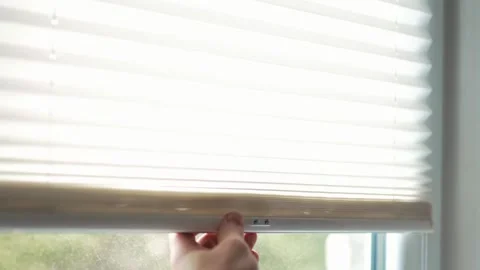 Close up of hands fixing a window pleated blind mechanism with a screwdriver Stock Footage 340159599