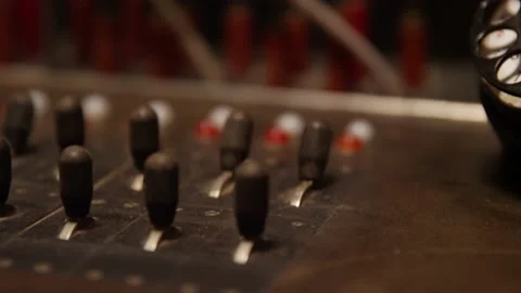 Close up of hands flipping switch on old telephone switchboard Video stock 131339274