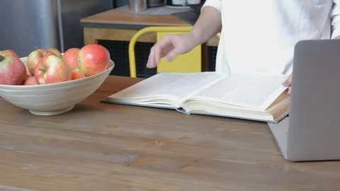 Close-up of hands flipping through cooking book pages Video stock 118976841