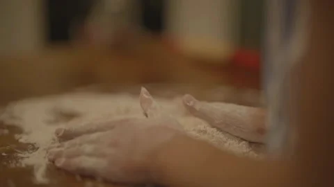 Close-up of hands in flour Stockbeeldmateriaal 336374663