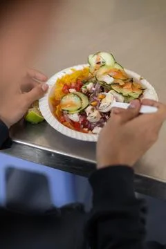 Close-up of hands, with food on table Foto stock