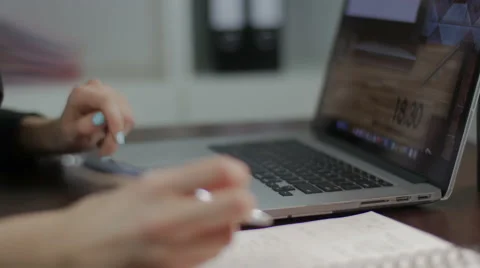 The close-up of hands of the girl working behind the laptop Video stock 58590644