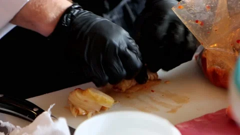 Close-up hands in gloves are rolling kimchi Korean national dish Stock Footage 171954031