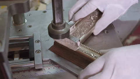 Close-up of hands in gloves, fixing the angle of wooden picture frame. making of Stock Footage 201389182