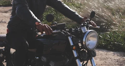 Close up of hands with gloves on handle of motorcycle Stock Footage 129523885