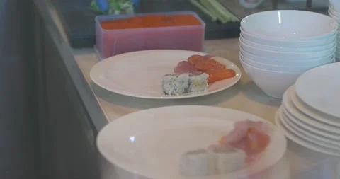 Close up of hands with gloves preparing and serving japanese food. Chef making Video stock 154932515