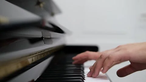 Close-up of hands gracefully playing piano keys. Elegance and serenity of piano Video stock 320171709