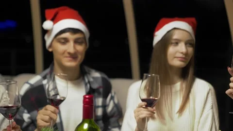 Close-up of the hands of a group of friends clink glasses of wine together for Stock Footage 167246080