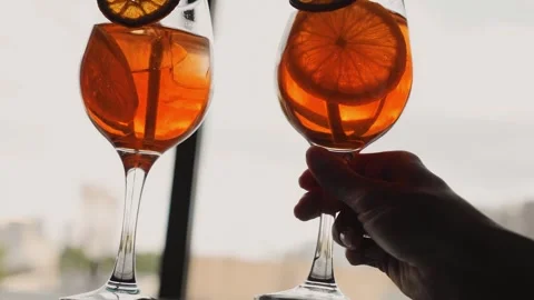 Close-up of the hands of a guy and a girl who take cocktails in glasses Stock Footage 245239729