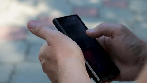 Close up Hands guy writes messages on a smartphone. Stock Footage 114914840