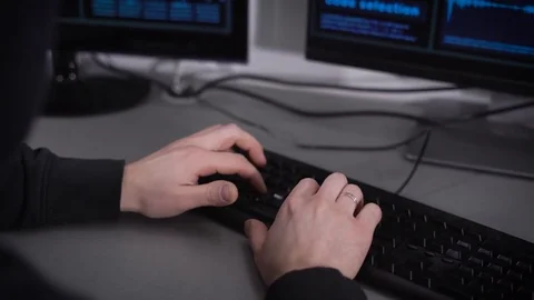 Close up of hands of hacker making cyber attack on bank network. Man typing fast Stock Footage 72426990