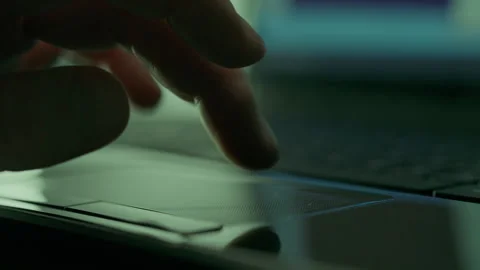 Close-up of the hands of a hacker programmer working with the mouse and keyb Stock Footage 254891399