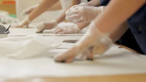 Close up of hands hands ink printing in an art class Stock Footage 296845989